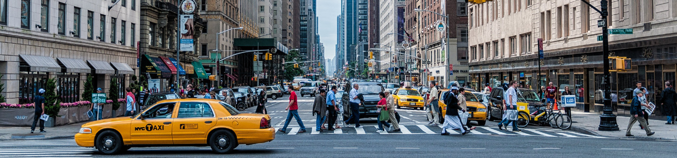 pedestrians crossing a street in NYC